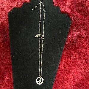 Silvertone hammered PEACE necklace